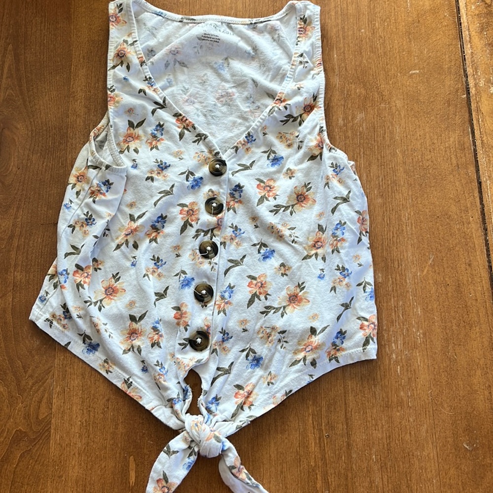 Floral tank with waist tie details.